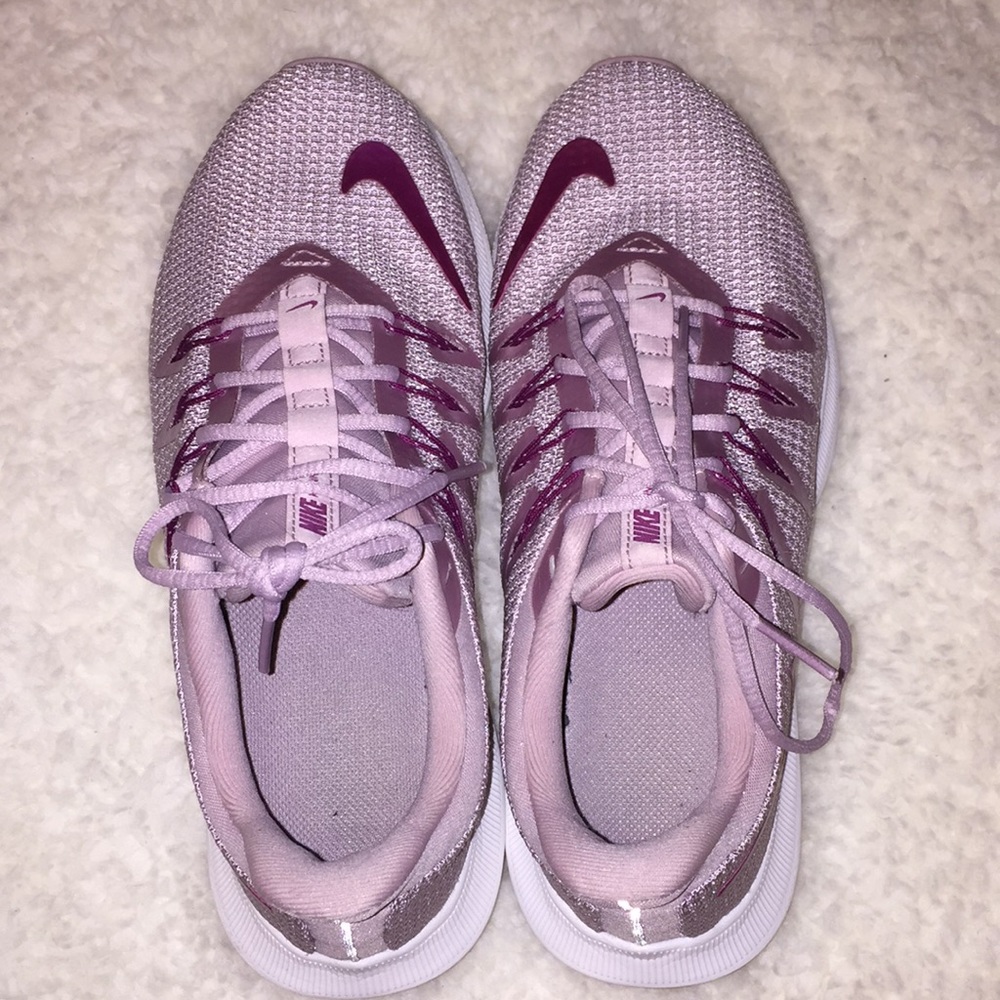 running purple nike shoes